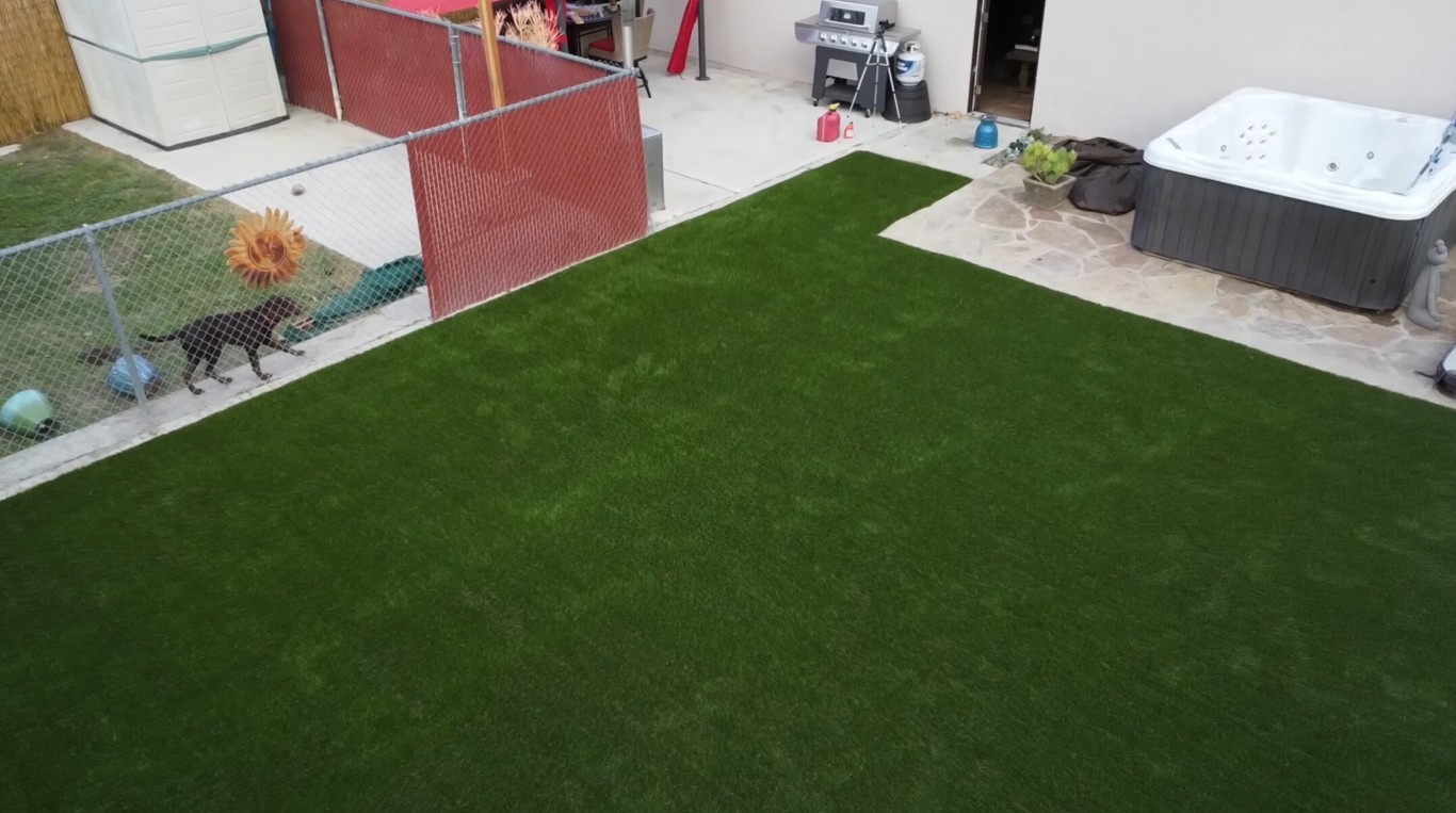 Professional artificial grass installation in Huntsville backyard