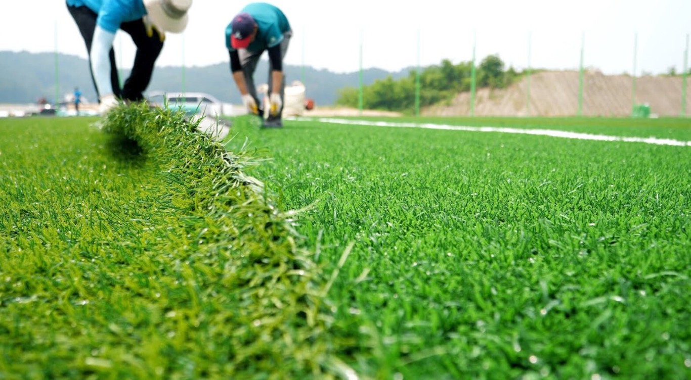 Commercial artificial grass installation for sports field in Huntsville, AL